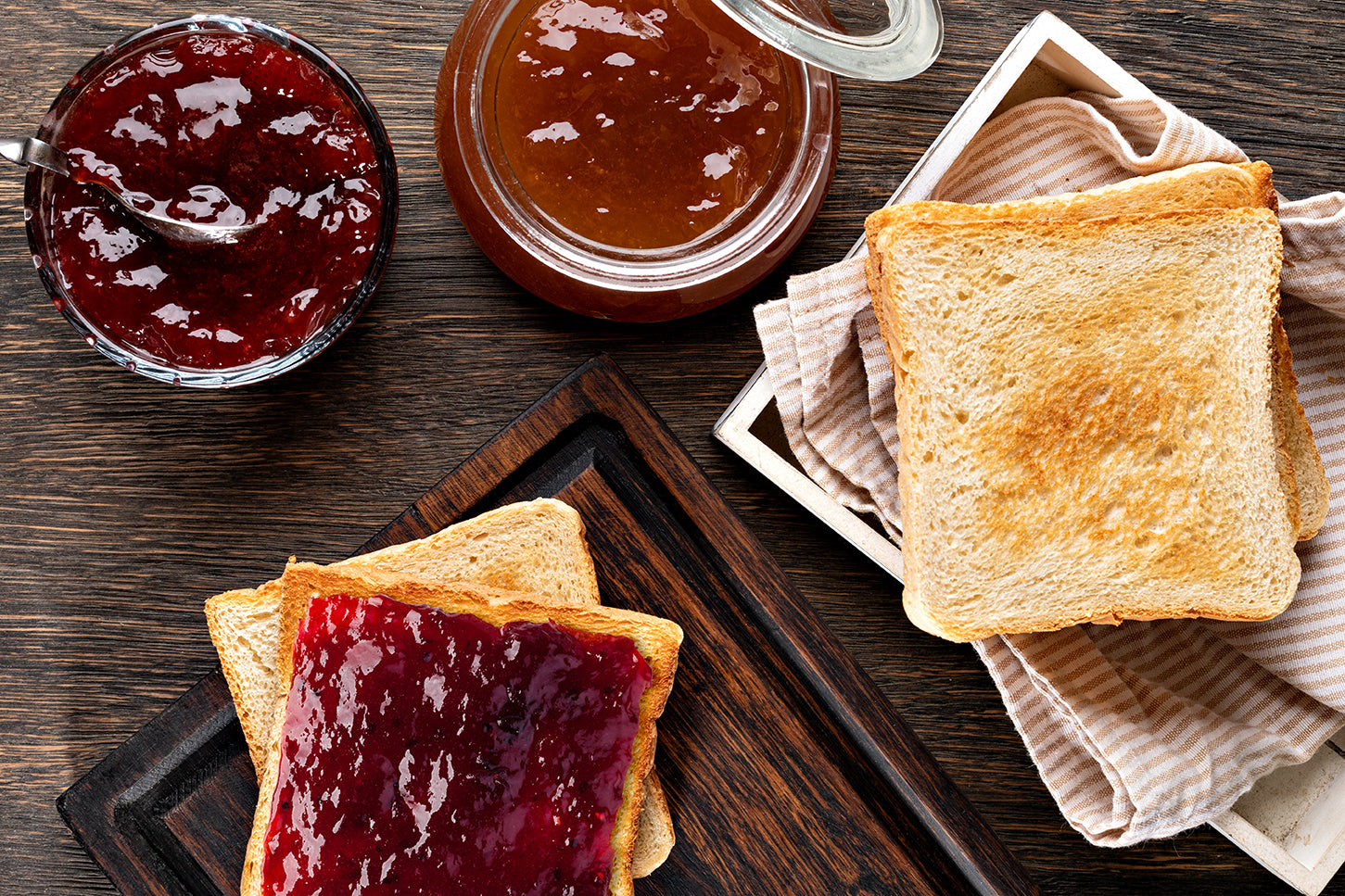 Toasted bread served with Moran’s homemade jam and marmalade on a wooden breakfast table